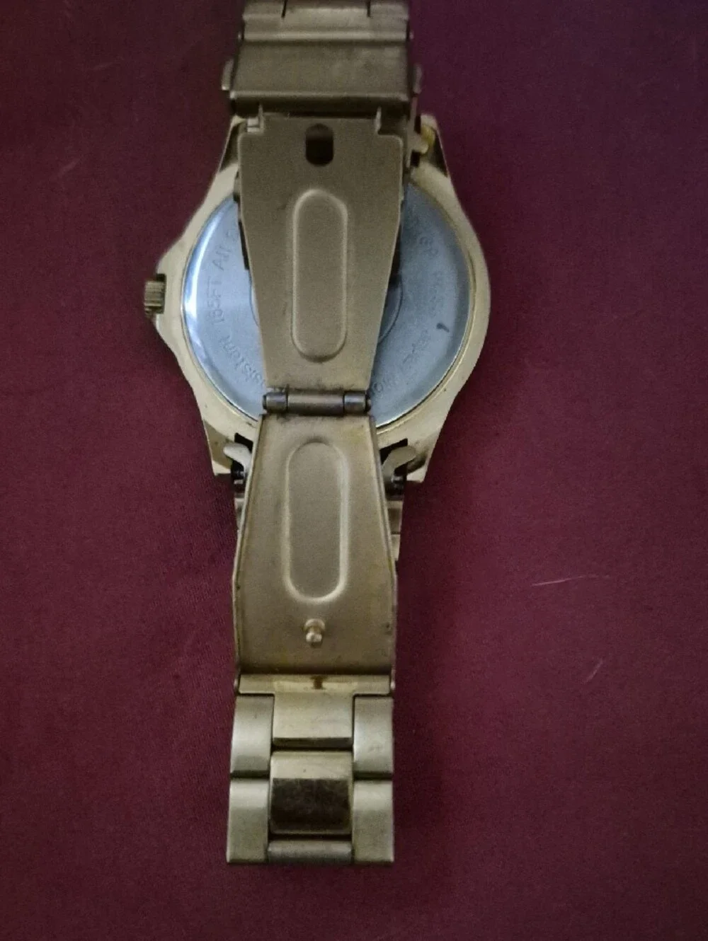Armitron Gold-Tone Watch with Black Dial and Day-Date